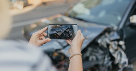 taking a photo of a car accident
