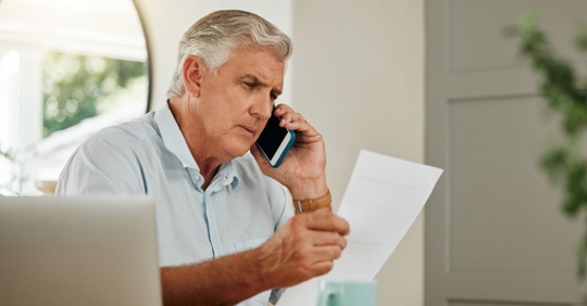 person talking to insurance company on the phone
