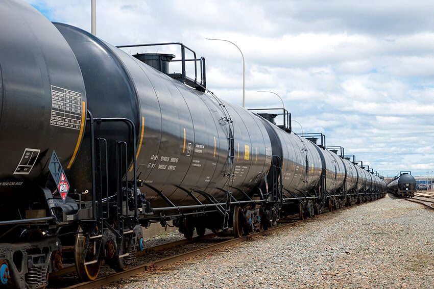 long black train in a rail yard