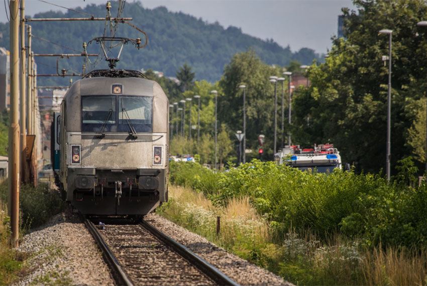 railroad train attached to overhead lines